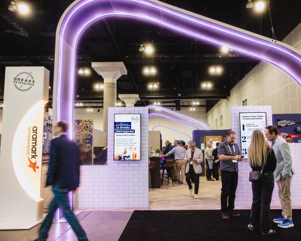 Attendees explore the Aramark Refreshments Breaks Reimagined activation at NAMA 2026 