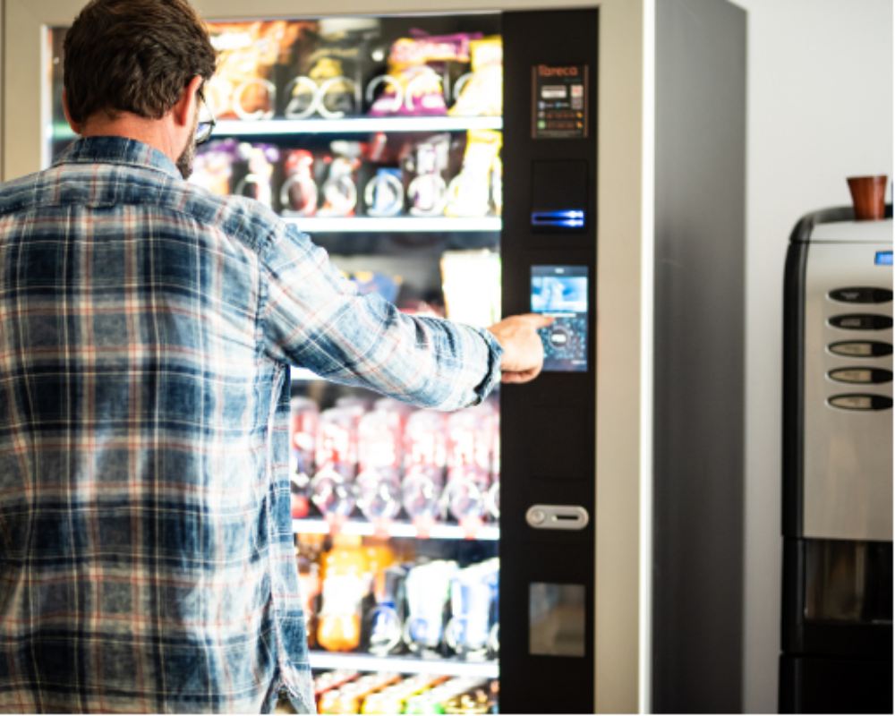 Man purchasing from vending machine